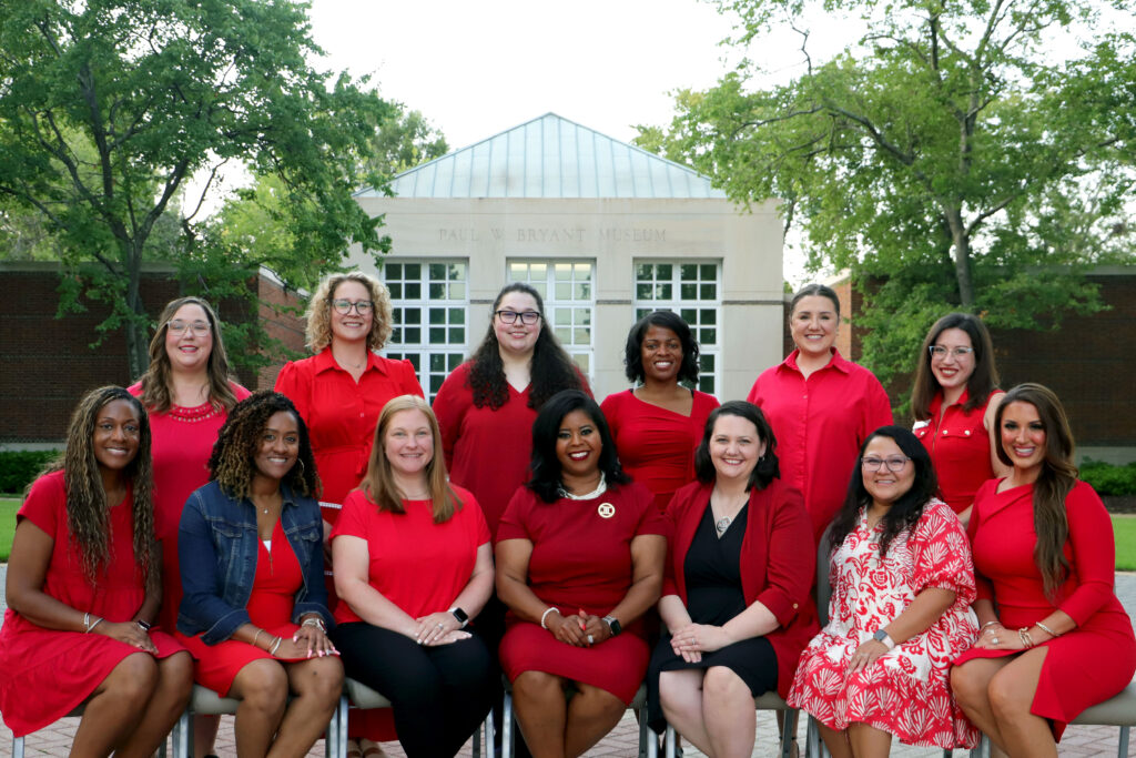 group photo of the 2025-2026 leadership team wearing red